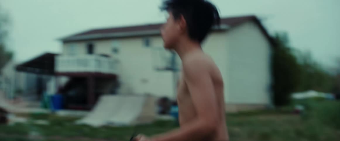 A boy skipping rope in his backyard training