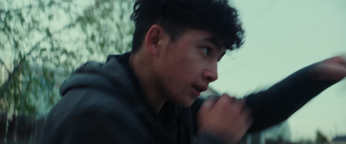 A person boxing outdoors