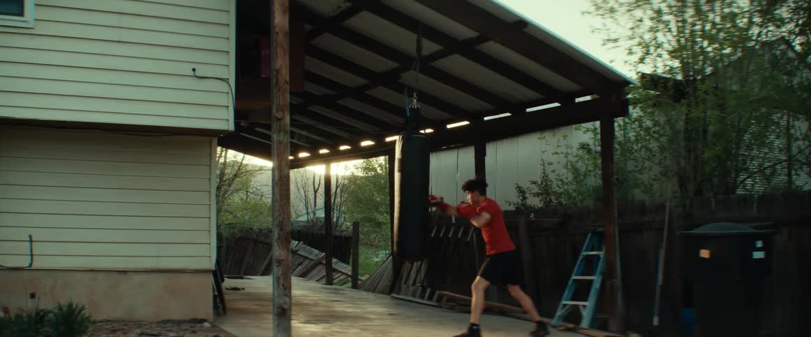 A man boxing against a bag