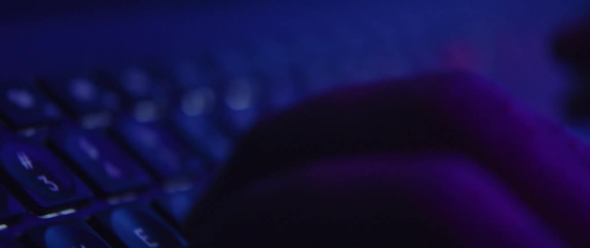 Someones hands are typing on a computer keyboard