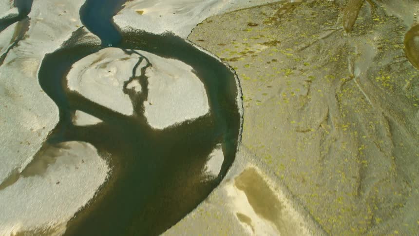 The river runs through the alpine landscape in the South Island of New Zealand