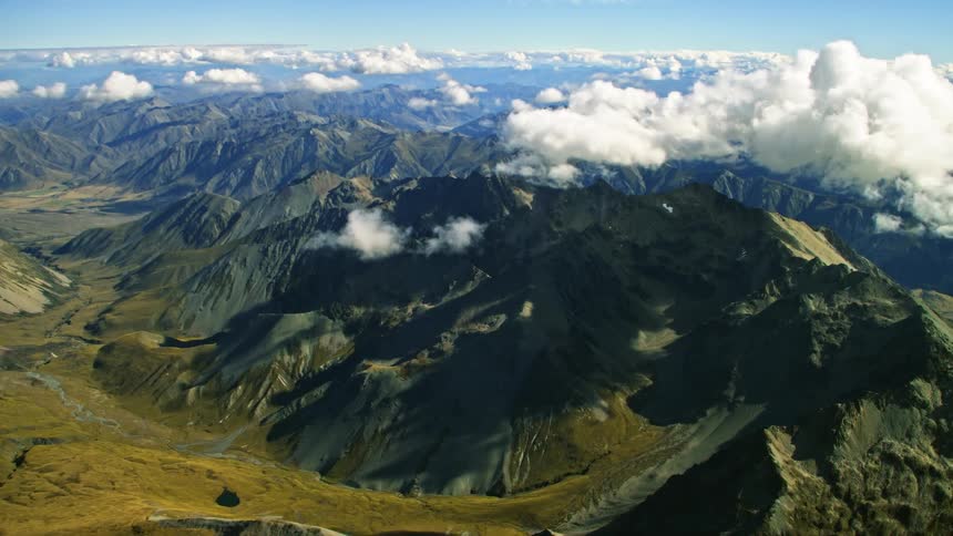 A small stream runs past the mountain range