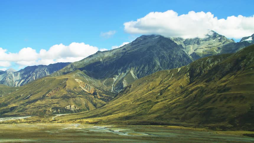 Clouds floating above mountains in nature