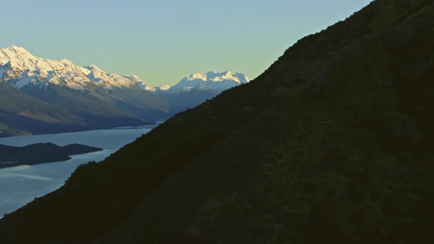 A lake runs through the mountain range