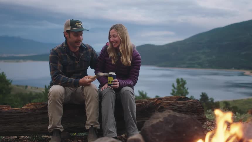 A man and woman sitting outdoors