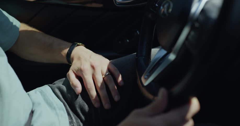 A man is driving a car