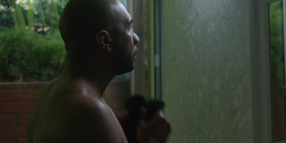 A man is washing his face in the bathroom