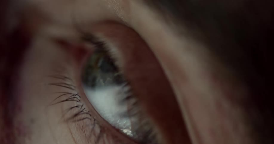 The eye blinks repeatedly