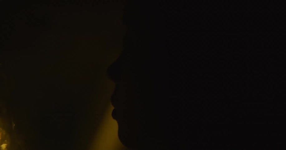 A woman sitting in a car with fluttering eyes falling asleep as the car travels at night