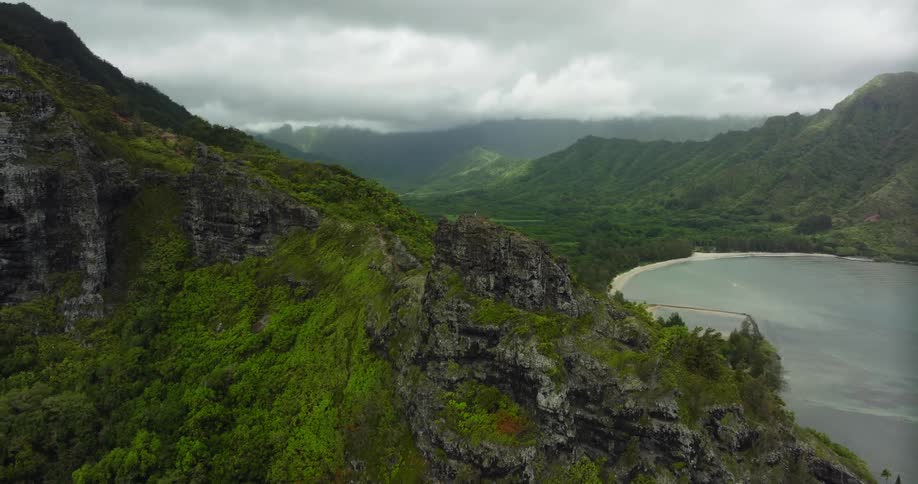 A lake sits at the base of a vast canyon