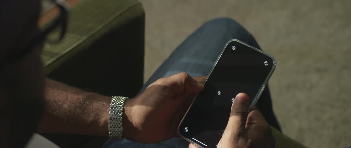 A person scrolling on a smartphone