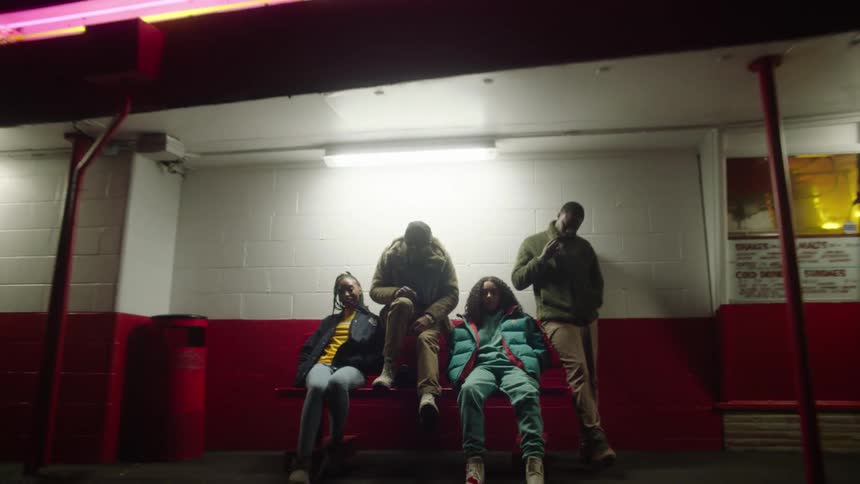 A group of friends sitting outdoors