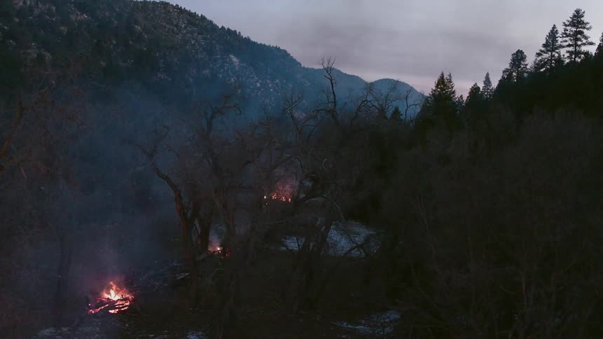 Multiple fires blaze on a cloudy day