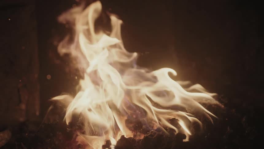 Flames rise from a fire