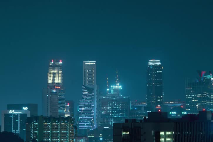 Time lapse of lights flashing on high rise office buildings in a downtown area