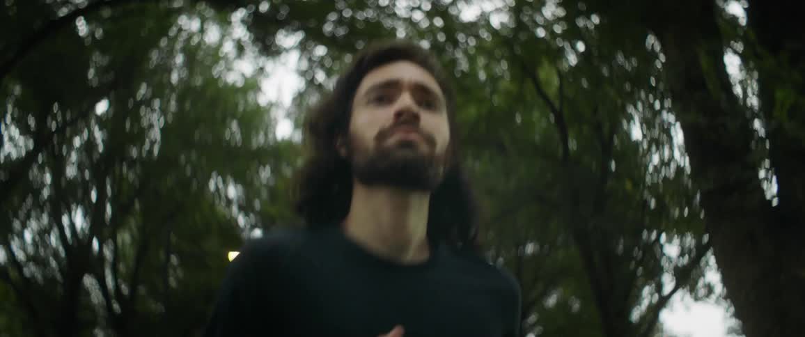 A young man jogs outside