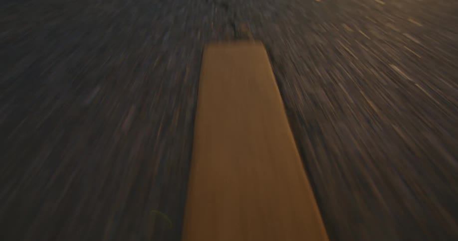 Freshly paint yellow lines mark the center of a road