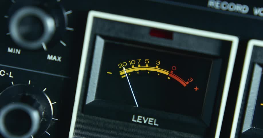 A needle moves on a gauge as it monitors a recording level