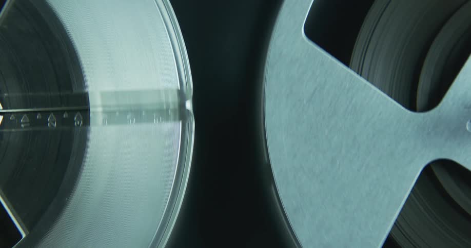 Two tape canisters rotate on machine