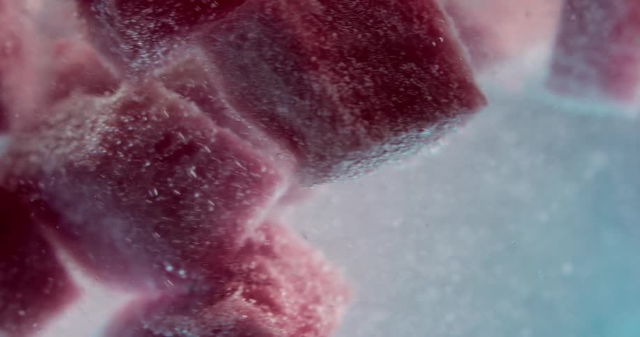 Blueberries and watermelon floating in a carbonated drink