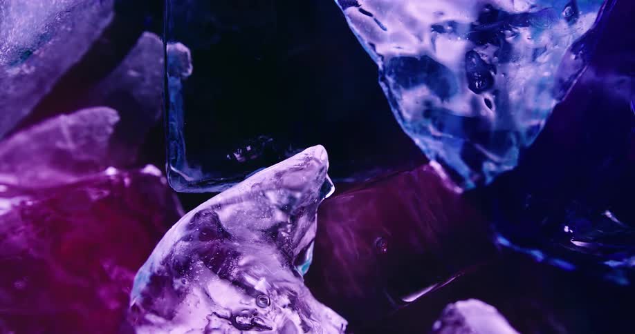 Light shines on blue and purple crystals with roughly straight edges