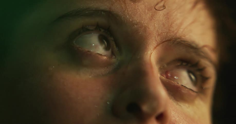 Water shows woman staring as she blinks