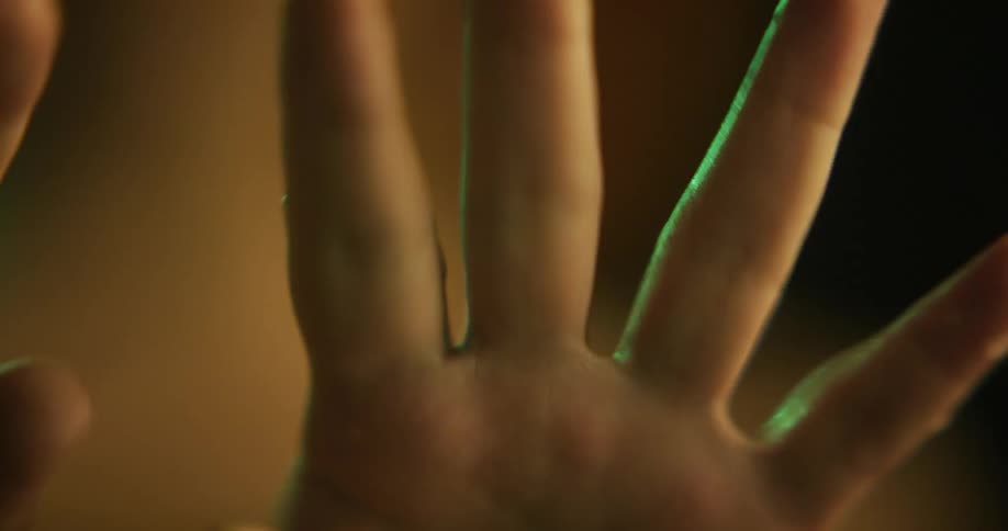 A womans hands moving and squeezing shut and opening