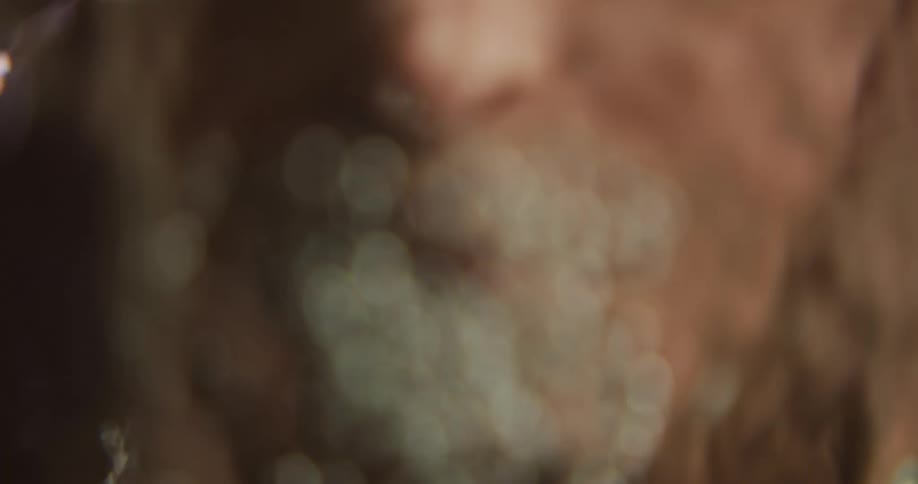 A person is washing their face in water