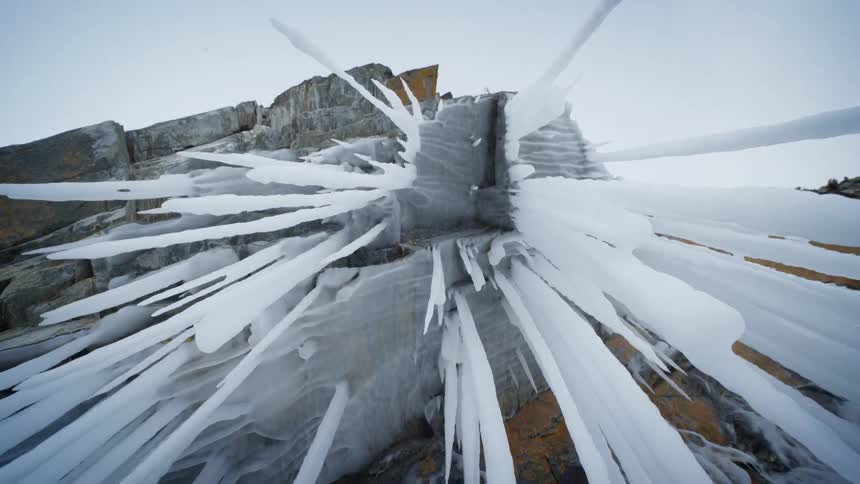 Giant icicles hanging down from a rock ledge
