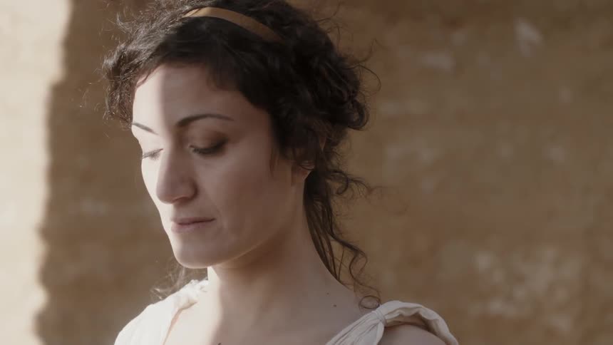A woman's hair blows in the wind
