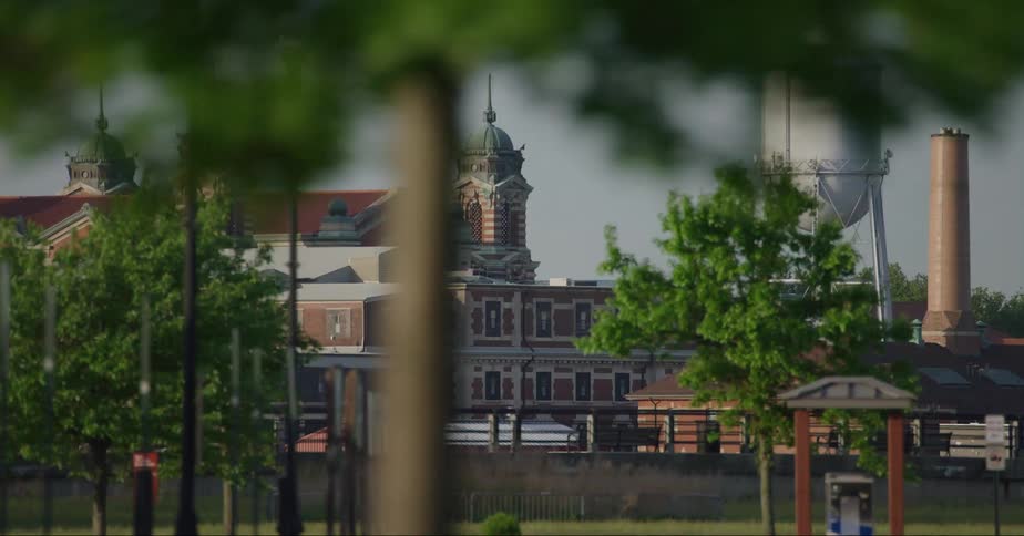 A water tower is by the buildings