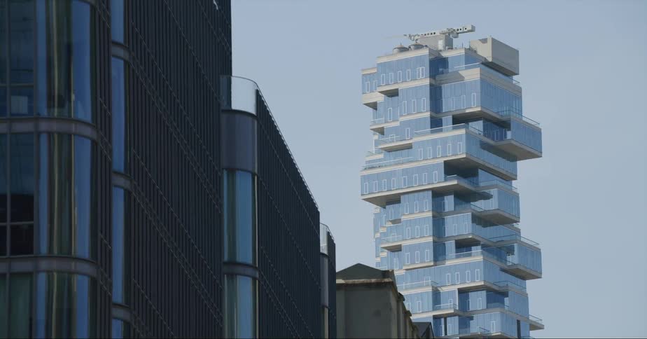 An unusual building that looks like it was built from blocks stands tall in the city