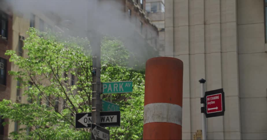 Smoke rising from a smokestack in a city
