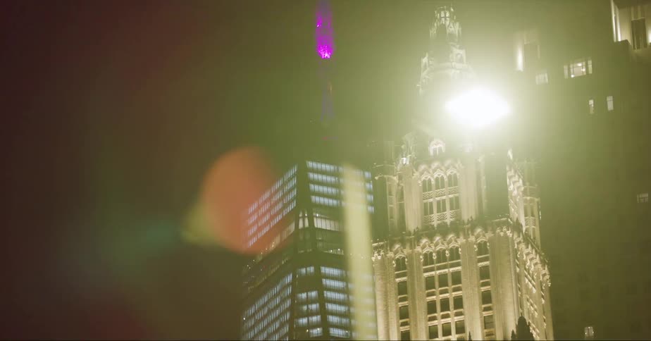 Buildings and skyscrapers in a city at night