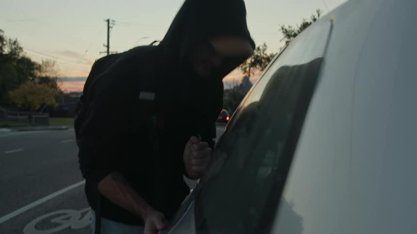 A man breaks into the car