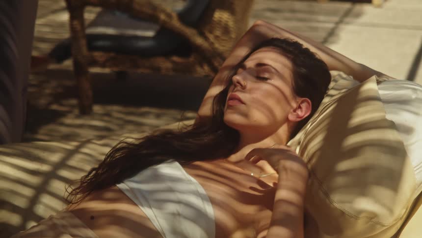A woman is resting outside