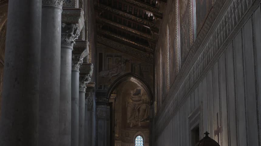 A long hall is lined with pillars
