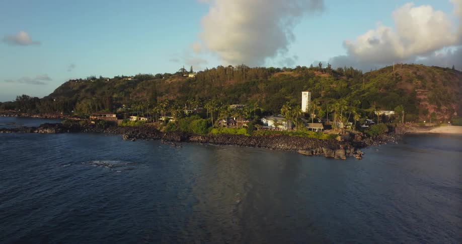 The rocky coastline of a small town during the day