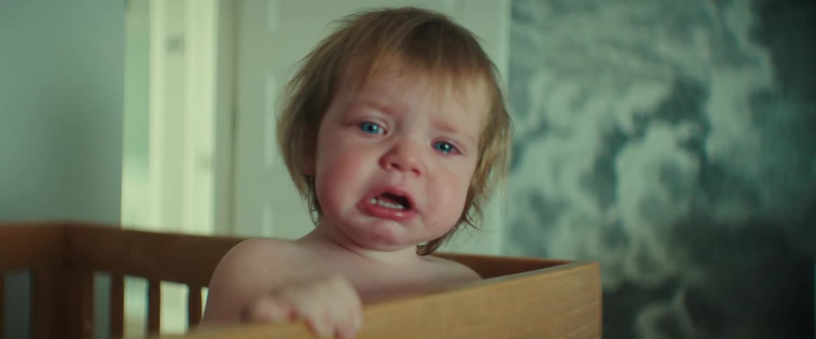 A baby is crying in the crib