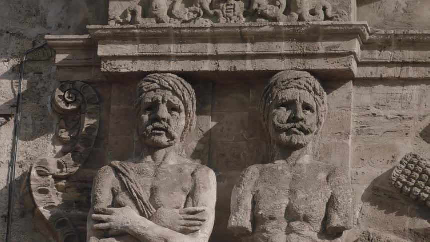 Statues carved into a wall