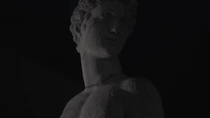 A stone statue of a man's torso
