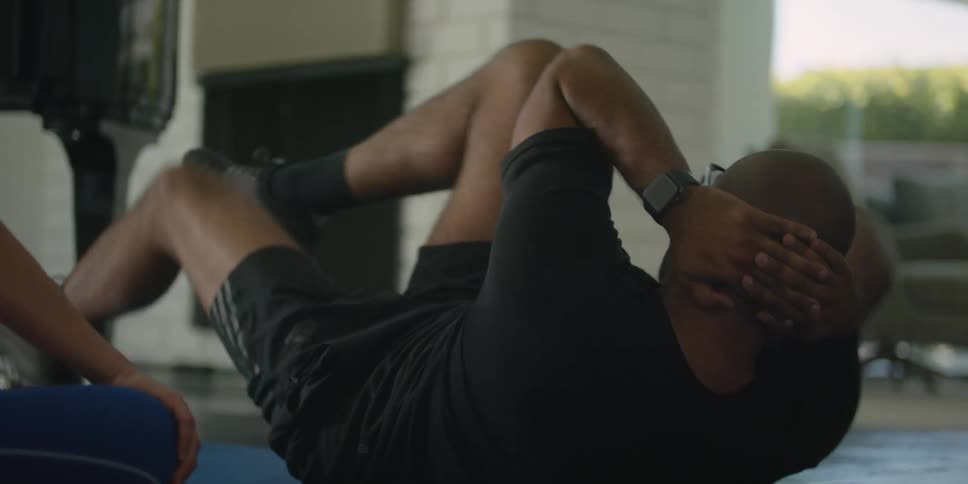 A man is working out on the floor