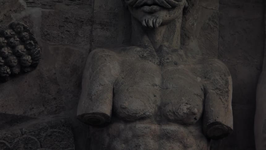 An armless statue on the wall