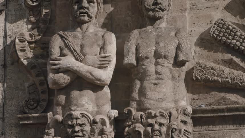 Ornate stone carvings on the outside of a building