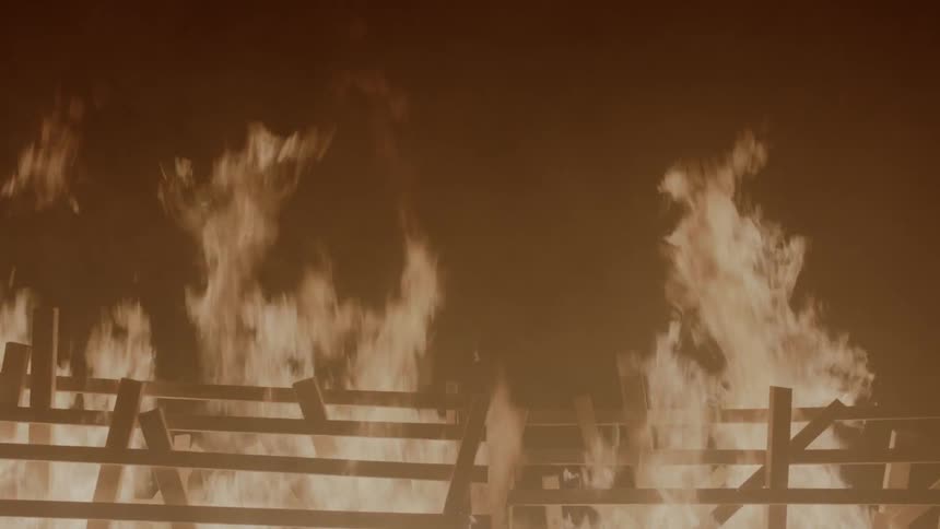 Wooden structure engulfed in flames