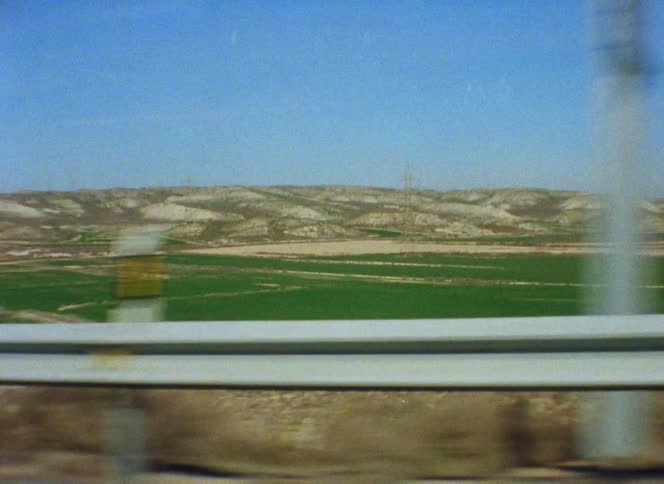 Utility poles in a field