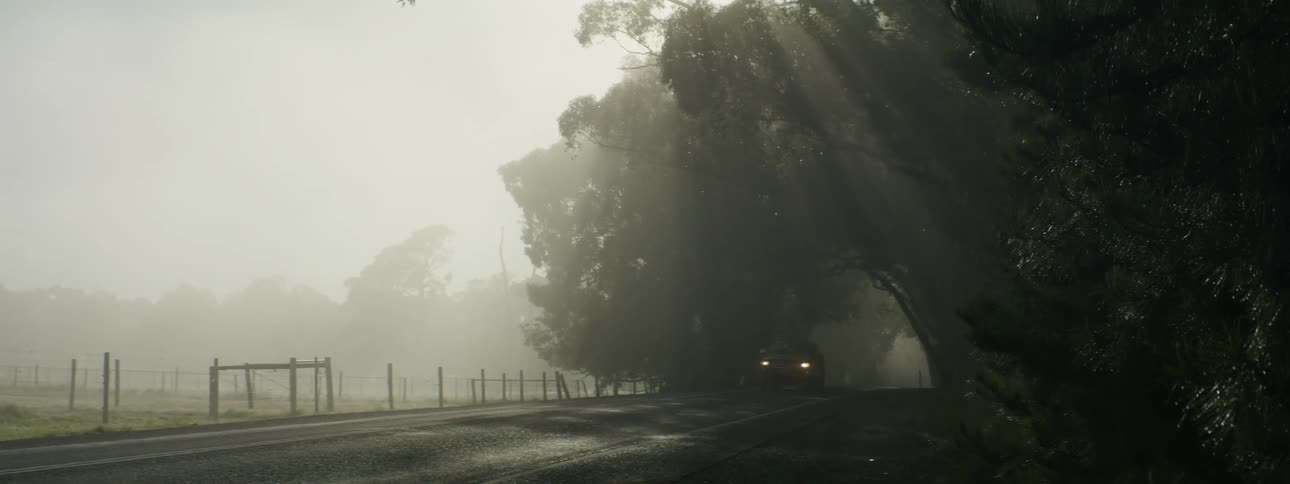 A truck driving down a road