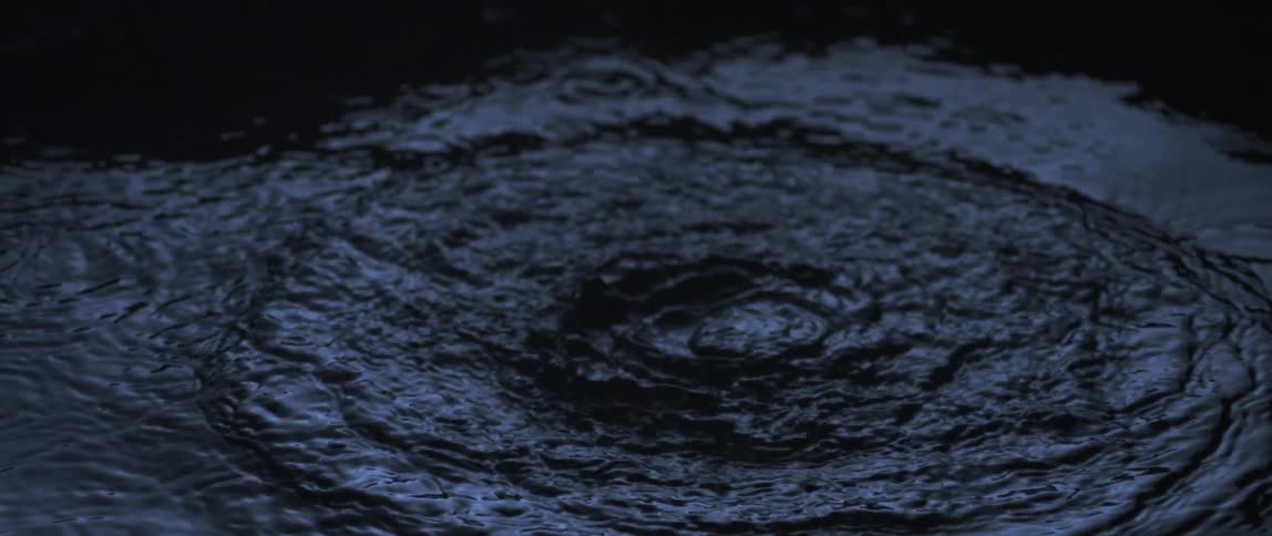 A view of water dropping into a lake
