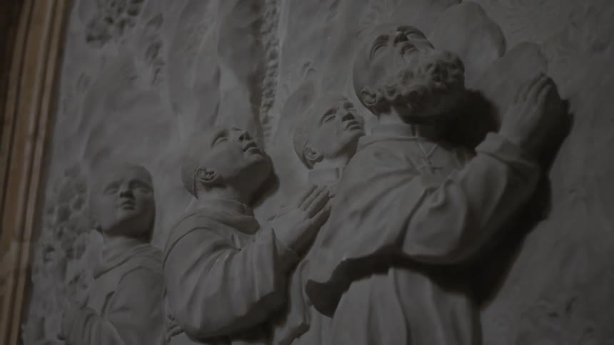 Carved men on a wall