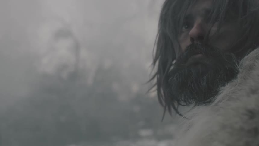 Bearded man standing in a smoky forest